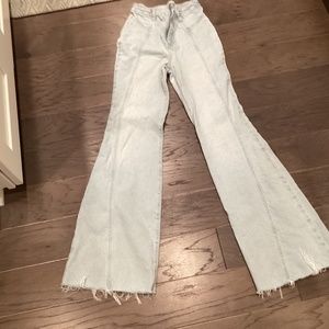 Free people flare high waisted jeans.